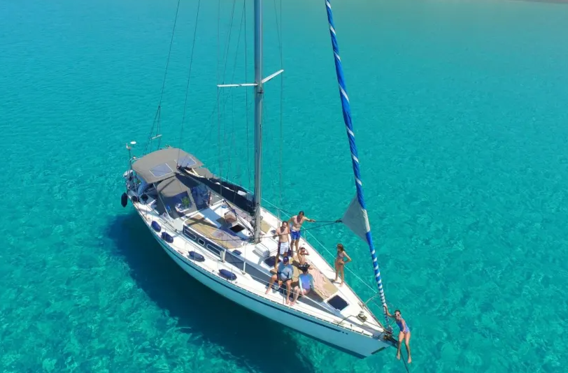 Marina Lefkas pier lined with moored yachts at golden hour